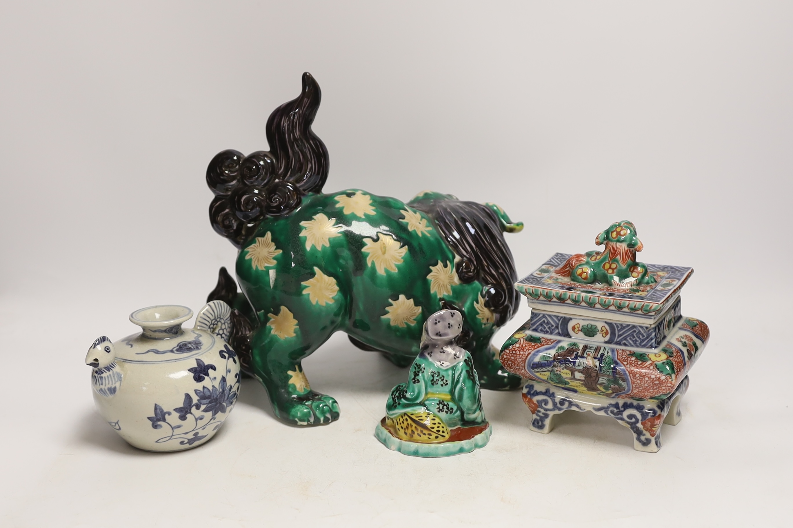 A Japanese Dog of Fo, a box and cover figure and blue and white pourer, Dog of Fo, 25cm high